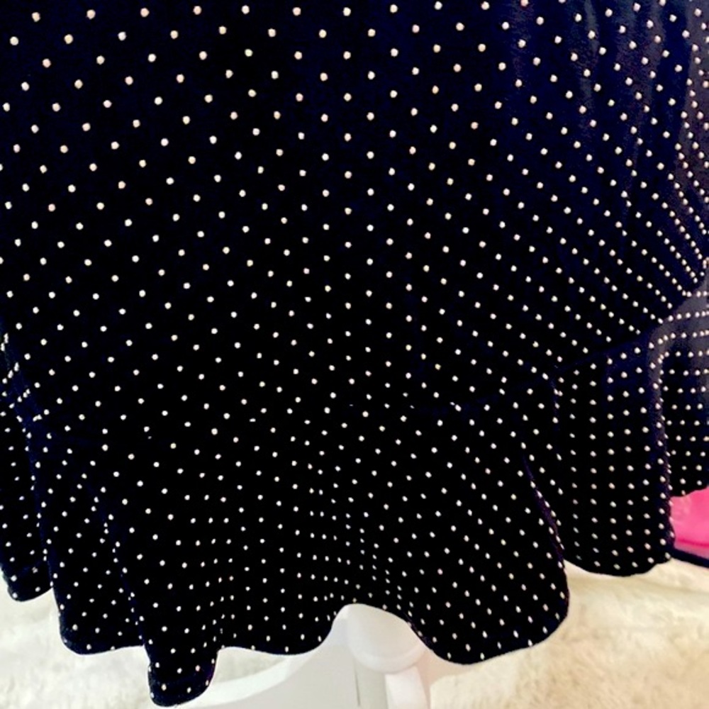 Stretchy black skirt with white pin dots & ruffle hem